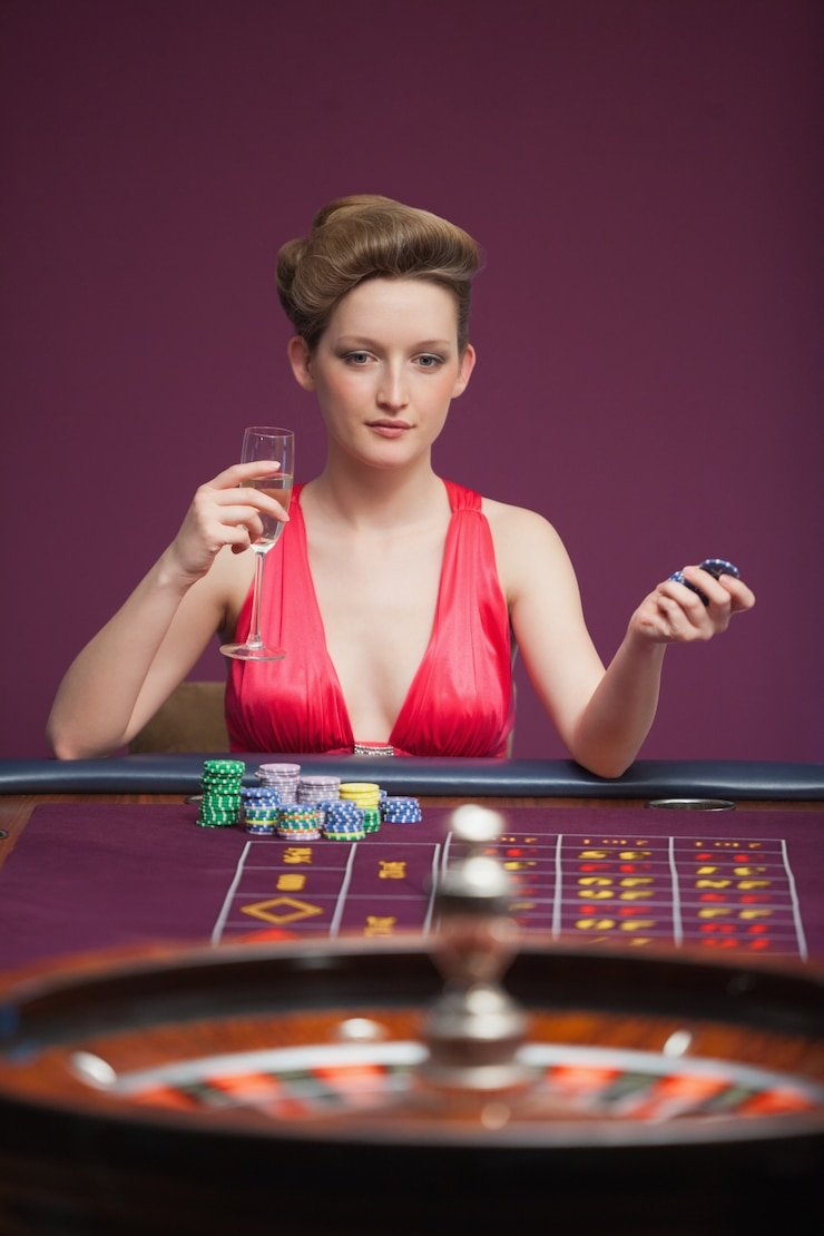 No Commission Baccarat live dealer studio with professional croupier and live broadcast monitor